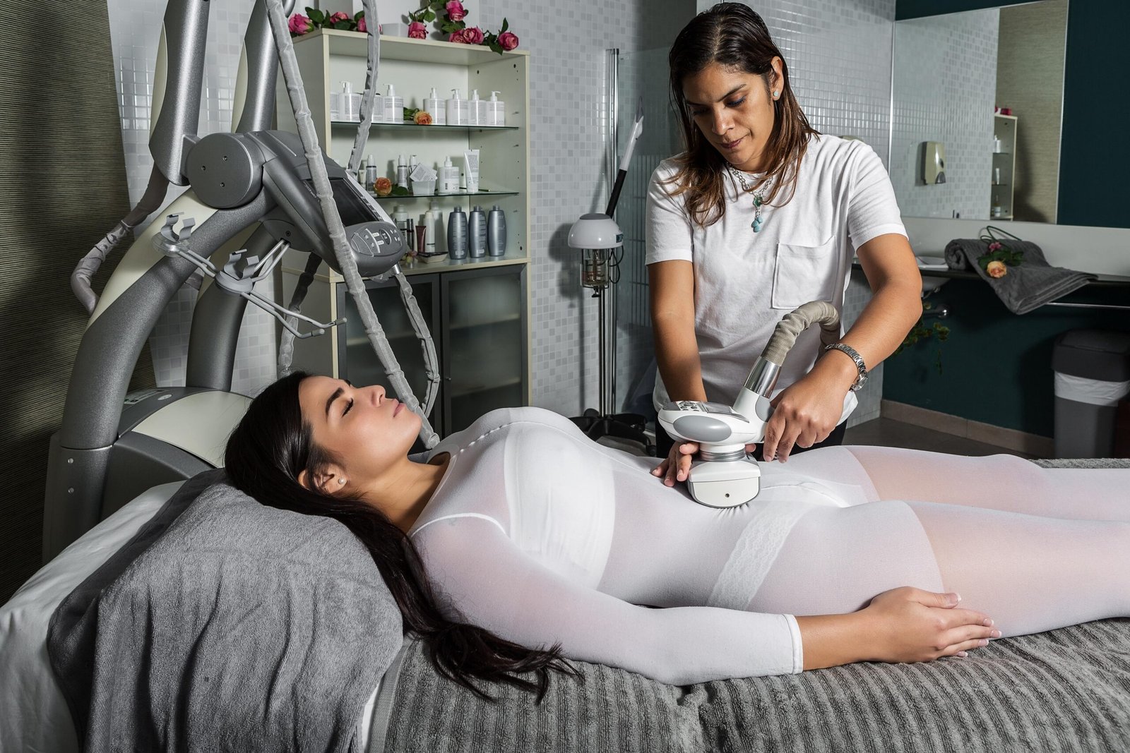 master-massaging-woman-with-modern-apparatus-2023-11-27-05-30-23-utc-min